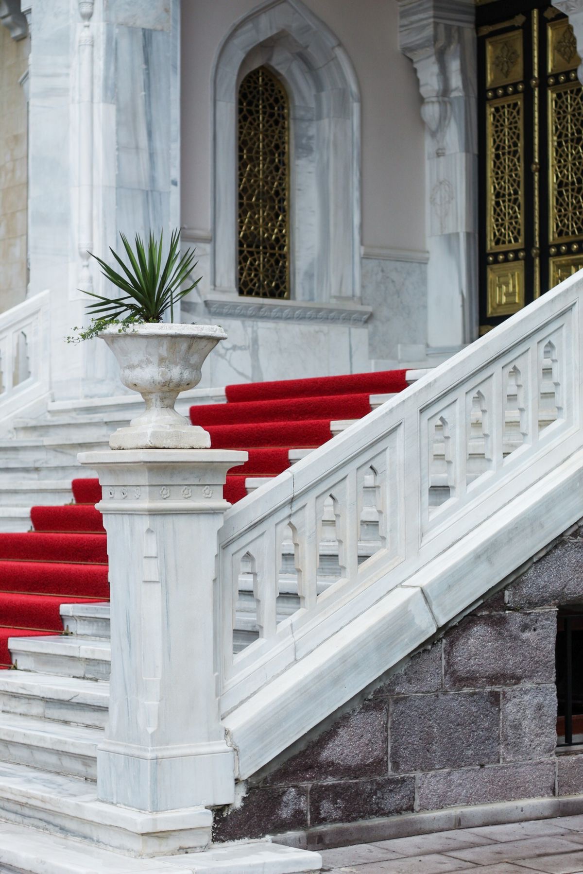 Red carpet covering steps at a formal venue entrance